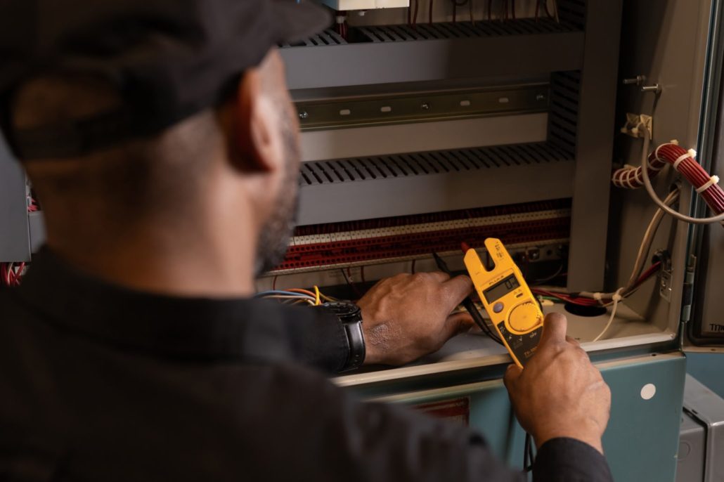 Service tech working on a commercial boiler